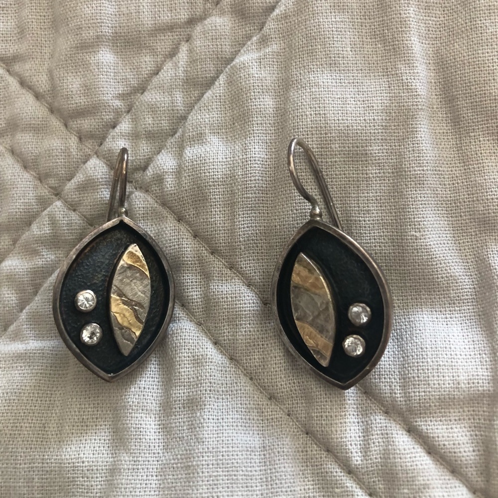 made by local artist. Sterling silver with Gold leaf and diamonds.